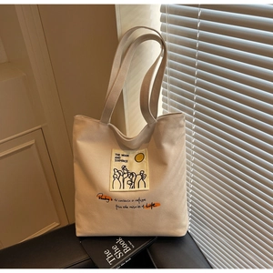 Detail of beige canvas tote with Moon and Sixpence quote and abstract art illustration