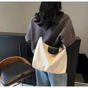 Minimalist large-capacity tote bag in cream white leather with black contrast flap detail