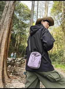 Lilac nylon drawstring crossbody bag with adjustable strap for outdoor leisure use