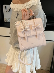 Sac à dos en cuir verni rose pour femme avec doubles nœuds et pendentif perle