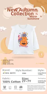 Close-up of Halloween cat and pumpkin print on 100% cotton girls' long sleeve tee