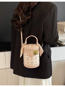 Creamy white cylinder bucket bag with cartoon bear patterns and silk scarf handle