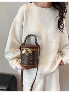 Retro brown teddy bear cylinder bucket bag with monogram print and woven handle for women