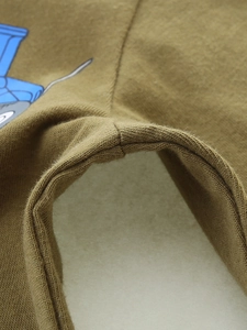 Olive green cotton knit pants for boys featuring reinforced stitching and blue print