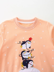 Coral orange girls sweatshirt with polka dots and festive penguin embroidery