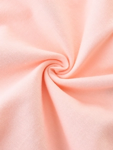 Pink knit cotton girls dress showing soft fabric texture and pleated detail