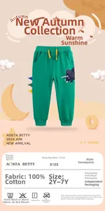 Détail du pantalon en coton pour enfant vert avec broderie dinosaure et cordon jaune