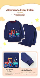 Détails de la broderie tracteur de Noël et des poignets côtelés du sweat bleu marine enfant