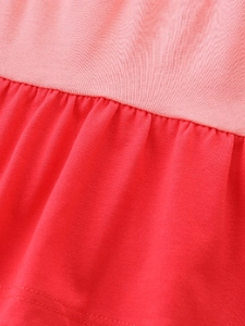 Girls' long sleeve knit princess dress featuring pink colorblock and pleat details