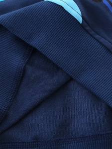 Dark blue boys' cotton sweatshirt detail showing soft loopback knit fabric and rib cuff