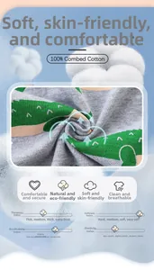 Detailed view of 100% combed cotton fabric with green dinosaur print on grey melange