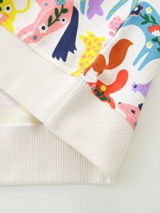 Kids cotton sweatshirt with colorful animal prints and ribbed hem in casual style