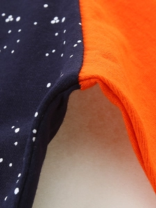 Kids long sleeve cotton shirt featuring blue starry print and bright orange color block