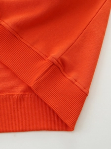 Orange cotton sweatshirt for boys with cartoon dinosaur patch and ribbed knit hem details