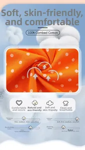 Détail macro du tissu 100% coton peigné orange à pois pour robe d'automne fille