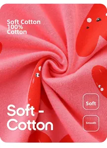 Close-up of soft 100% cotton pink knit fabric with red heart prints for girls' dress