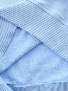 Light blue cotton knit sweatshirt for girls with ribbed hem and high-quality stitching detail