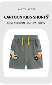 Close-up of olive green cotton shorts featuring elastic waist and tractor embroidery