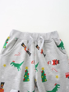 Kids grey Christmas joggers with nutcracker and dinosaur prints on soft cotton fabric