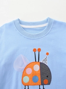 Light blue knit cotton girl sweater with round neck and cartoon ladybug embroidery