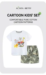 Close-up of cotton kids summer set featuring cartoon animals and tropical palm prints