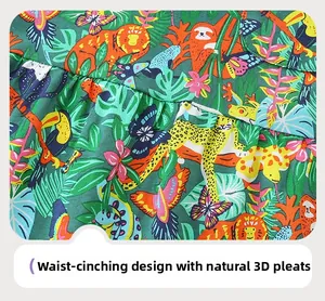Détail de la taille ajustée et des plis naturels 3D sur la robe à imprimé tropical