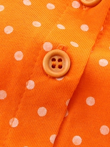 Robe en tricot orange pour fille à pois blancs avec détail de bouton en bois poli