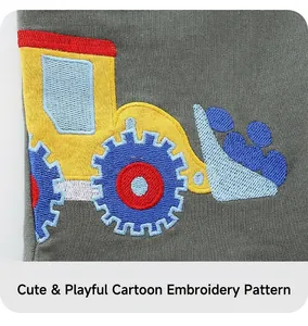 Detail shot of high-quality excavator embroidery on dark grey knit shorts for boys