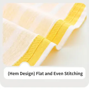 Détail de la couture d'ourlet soignée sur une robe pour fille en coton rayé jaune et blanc