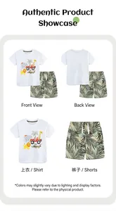 Detailed close-up of boys white cotton t-shirt with animal print and tropical leaf shorts