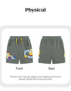Detail view of boys' green shorts featuring embroidered excavators and yellow drawstring