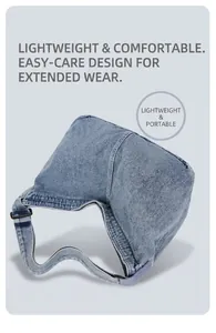 Detail der blauen Denim-Hobo-Tasche mit verstellbarem schwarzem Gurt und leichtem Stoff
