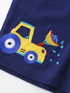 Dark blue boys knit shorts featuring a detailed colorful excavator embroidery detail