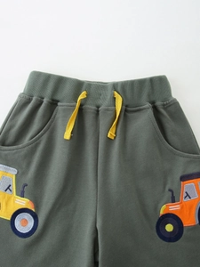 Dark green boys sports shorts with yellow drawstring and cartoon tractor embroidery