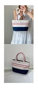 Detail of canvas tote bag with red grid pattern and blue stripes featuring silver snap button