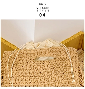 Close-up of bohemian crochet tote bag featuring intricate tassels and drawstring lining