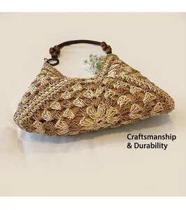 Detail of woven straw tote with round wooden bead handles and two-tone crochet pattern