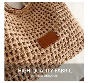 Close-up of hollow crochet texture and brown leather label on the woven tote bag