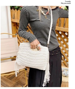 Detail of white crochet shoulder bag with bohemian fringe and drawstring lining