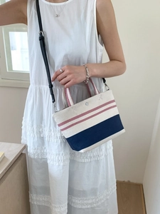 Canvas navy style striped tote bag with red handles and adjustable shoulder strap