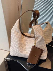 Chic beige straw woven hobo bag with brown leather strap and small side pouch