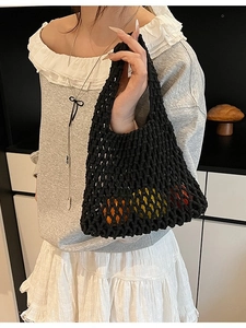 Chic black hollow-out knitted tote bag with thick woven rope for summer casual style