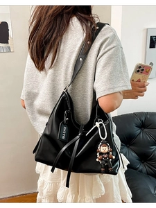 Minimalist black large capacity Hobo shoulder bag with astronaut charm for women
