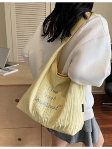 Large yellow pleated tote bag with Live Laugh Love text print for casual daily style