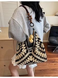 Handwoven geometric tote bag with beaded shoulder strap and crochet diamond pattern