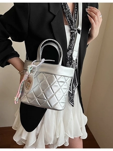 Chic silver quilted tote bag with lattice pattern and adjustable shoulder strap
