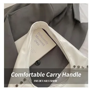 Detailed close-up of white PU leather strap with round silver studs and smooth finish