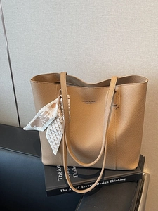 Brown litchi texture tote bag with elegant floral scarf on handle for daily use