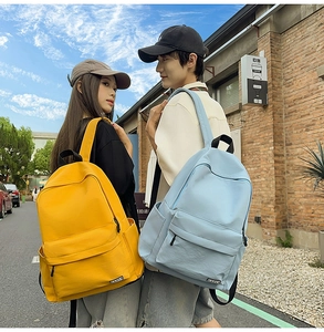 Detailed outdoor shot of minimalist nylon backpacks with multiple pockets and sturdy handles