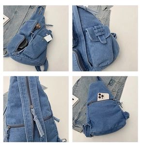 Detailansicht der Denim-Umhängetasche mit Multi-Pocket-Design und robusten Reißverschlüssen